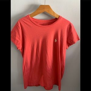 Pink polo T-shirt.